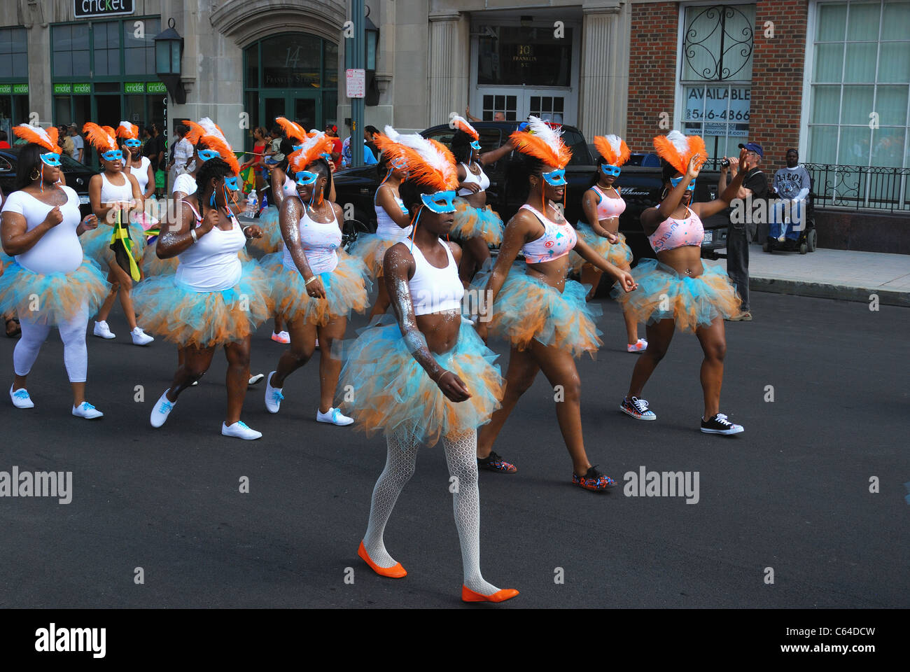 Woman's group representing Barbados march in Caribbean festival parade. Stock Photo