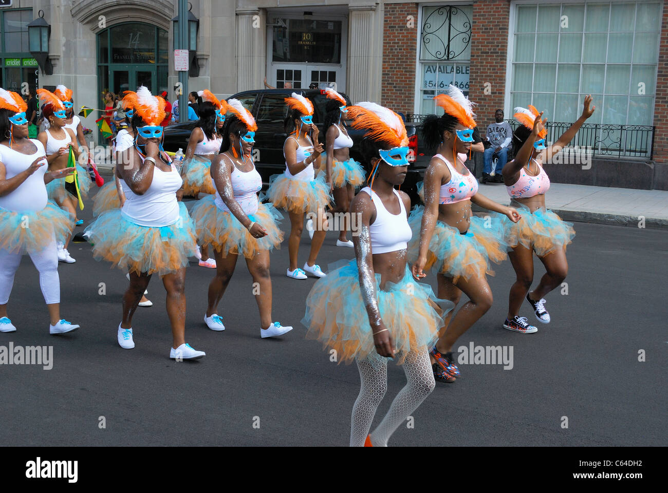 Woman's group representing Barbados march in Caribbean festival parade. Stock Photo