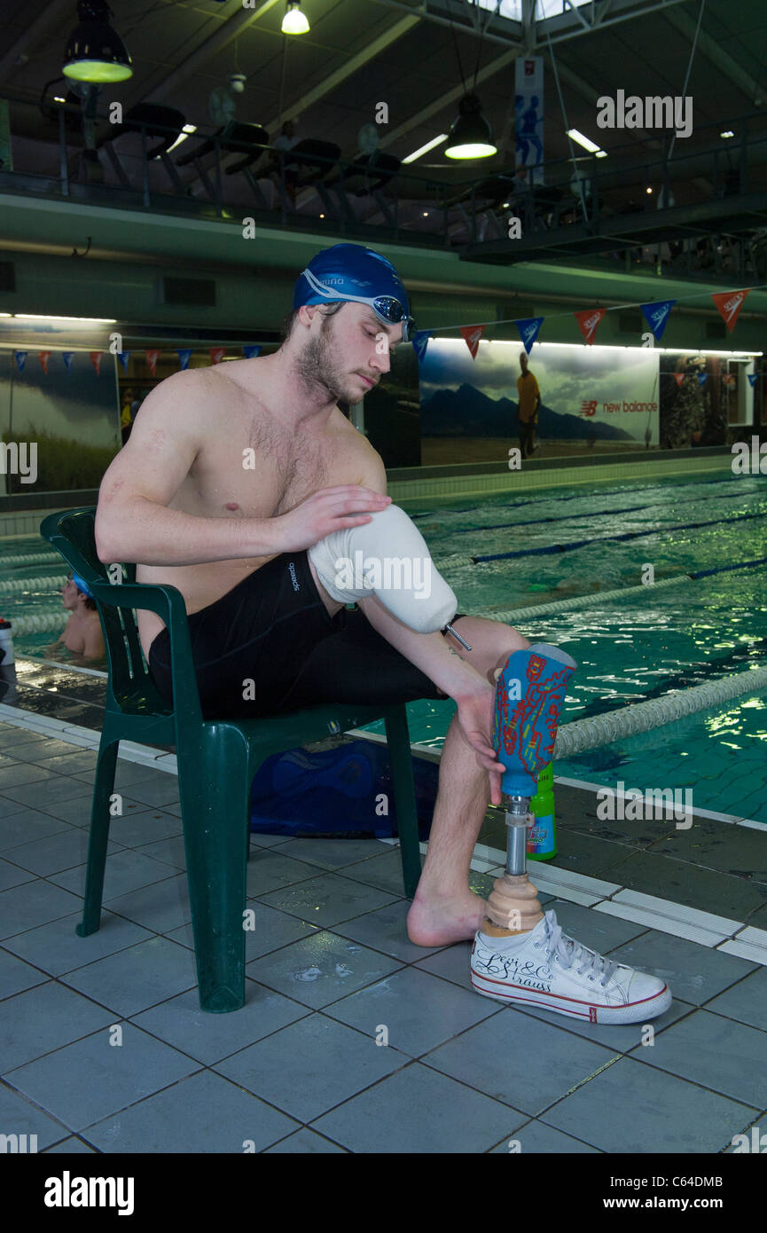 Swimmer removes his prosthesis Cape Town South Africa Stock Photo