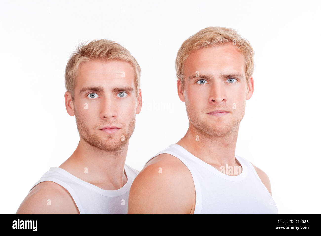 portrait of young twin brothers with blond hair and blue eyes