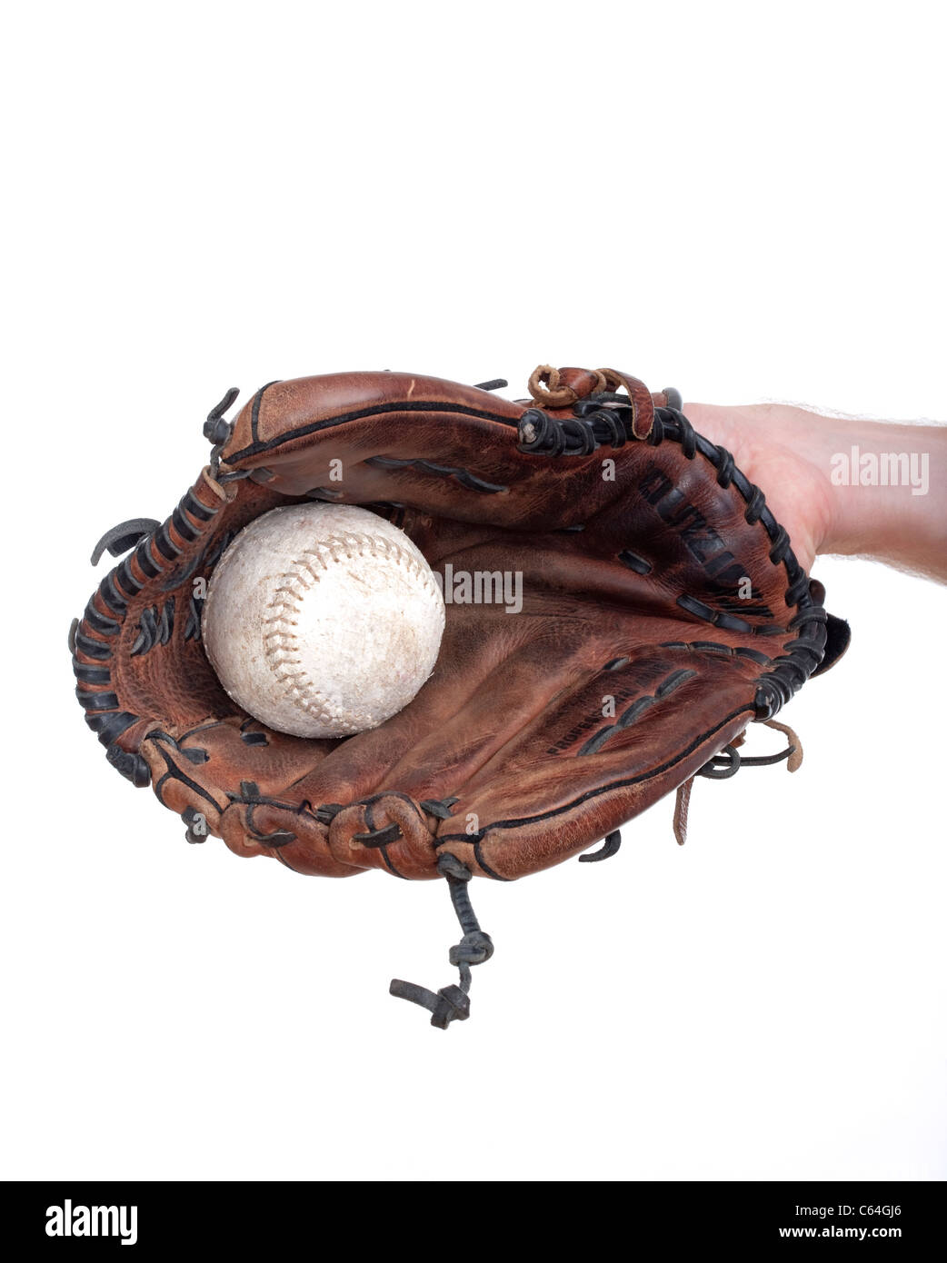 hand with a baseball glove with the ball in it isolated on white