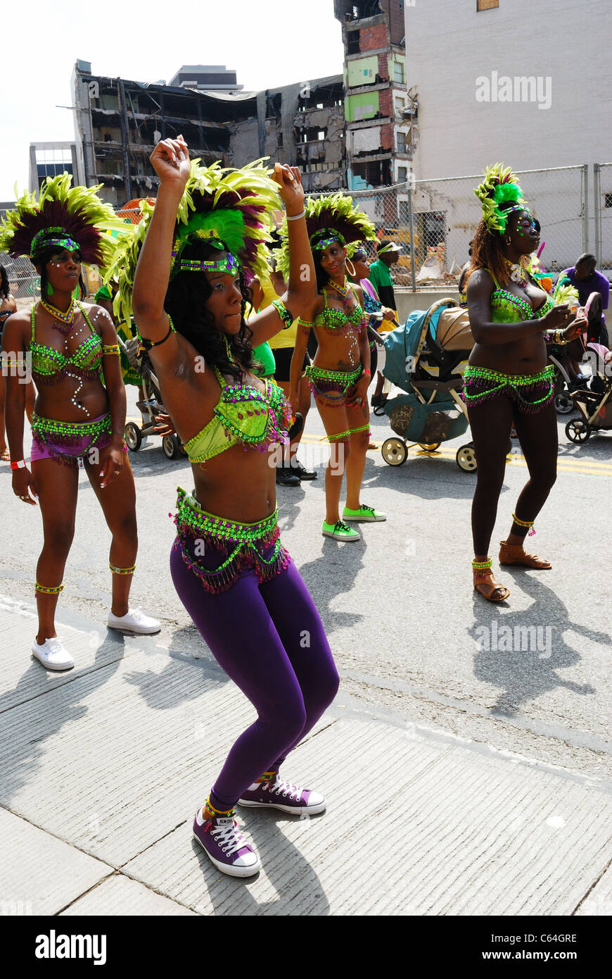 Jamaican women march and dance in Caribbean Festival. Stock Photo