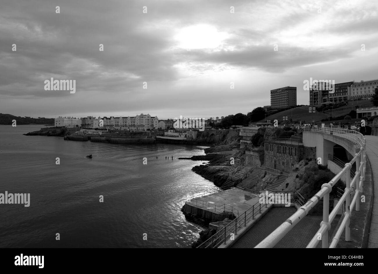 Plymouth Hoe and seafront promenade  overlooking Plymouth Sound at sunset - in black and white. Stock Photo