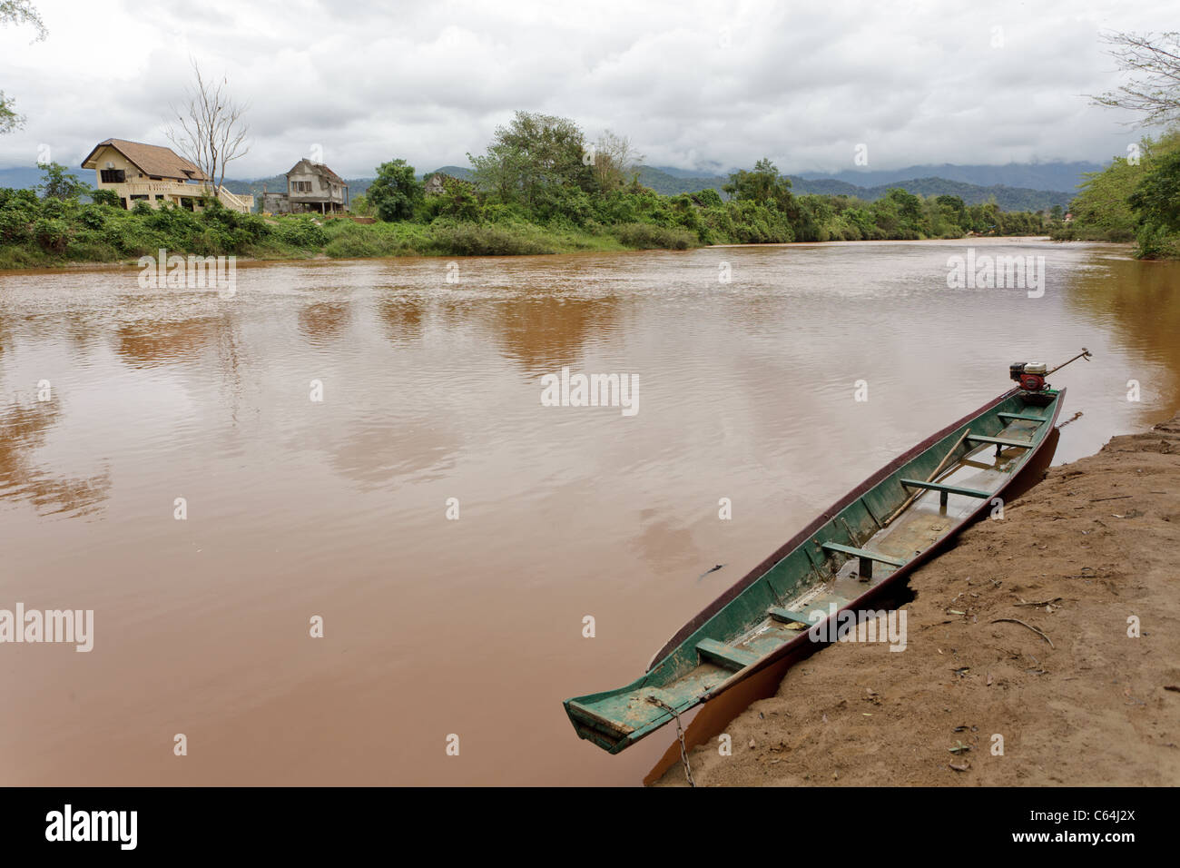 rowboat in Nam Song river under cloudy weather in vang vieng, laos Stock Photo