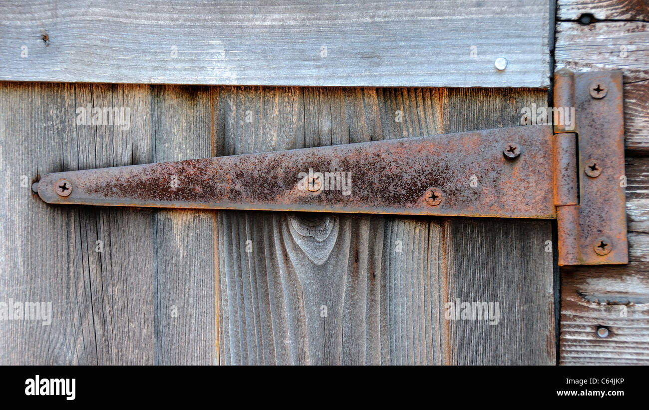 metal door hinge on wooden shed Stock Photo Alamy
