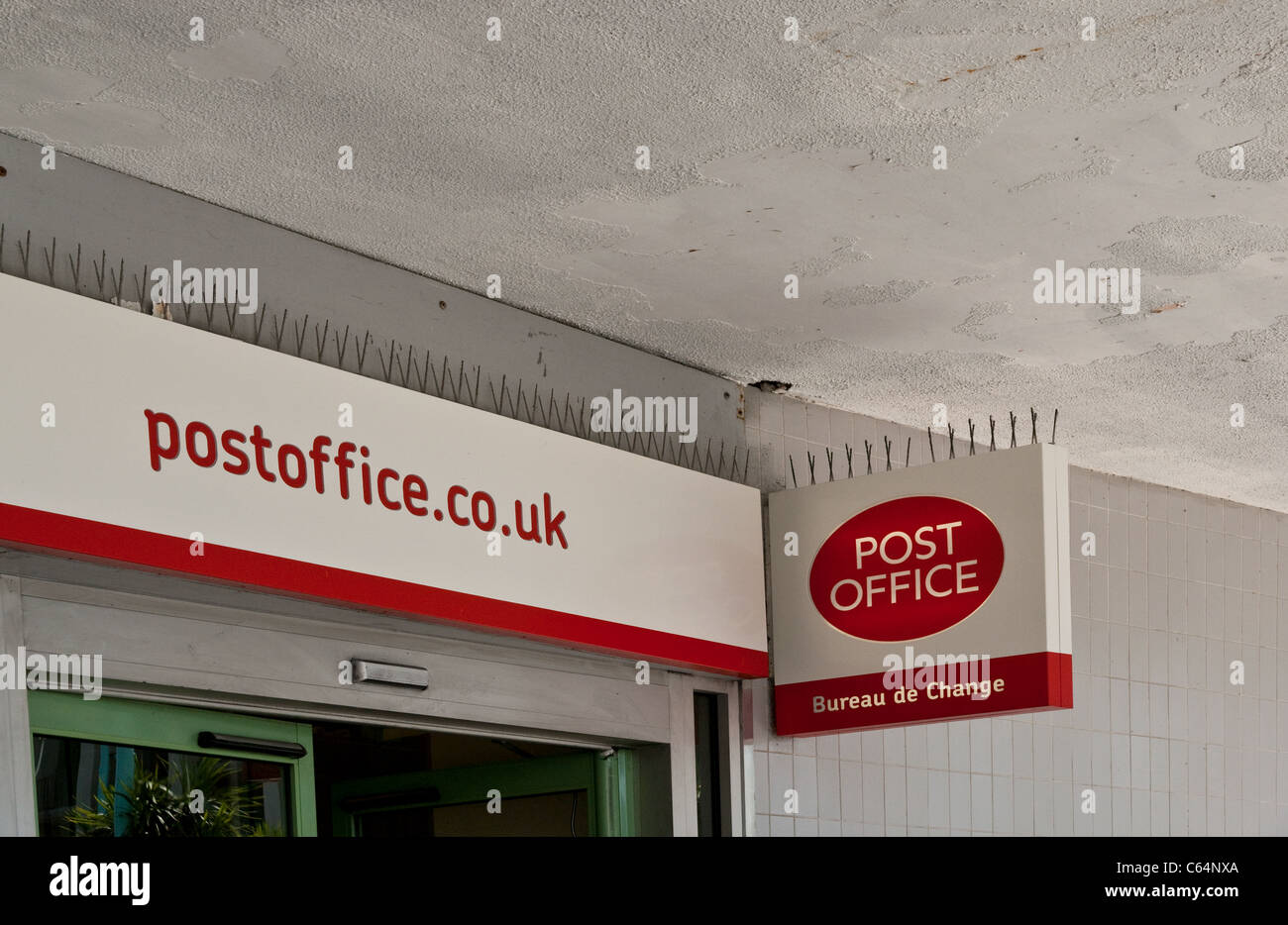 A landscape photograph of the post office sign and web address. Stock Photo