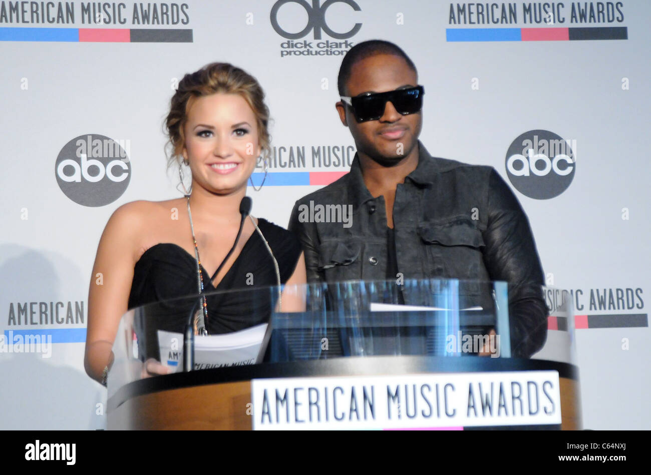 Demi Lovato, Taio Cruz at the press conference for 2010 AMERICAN MUSIC AWARDS (AMA) Nominations Announcement, JW Marriott Los Angeles at L.A. LIVE, Los Angeles, CA October 12, 2010. Photo By: Dee Cercone/Everett Collection Stock Photo