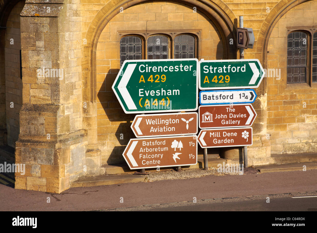 Roadsigns. road signs, at Moreton in Marsh in the Cotswolds, Gloucestershire UK giving directions to Cirencester, Evesham, Stratford in July Stock Photo