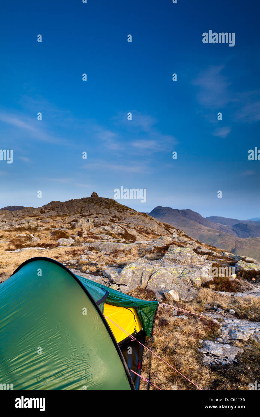 Wild camp. Tent pitched on summit of Pike OBlisco, Lake District national Park, UK Stock Photo