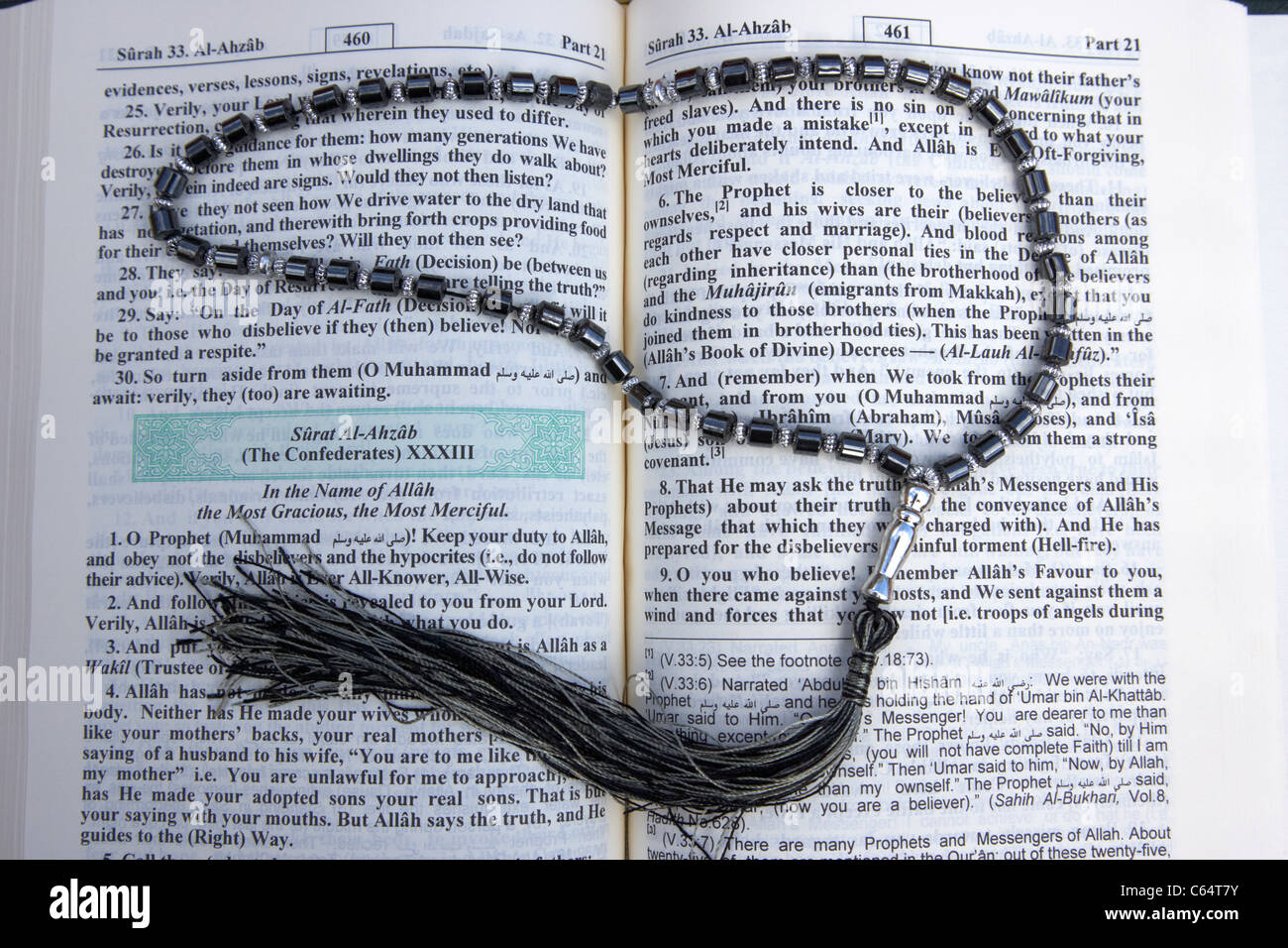 noble holy koran translated english version with prayer beads Stock Photo