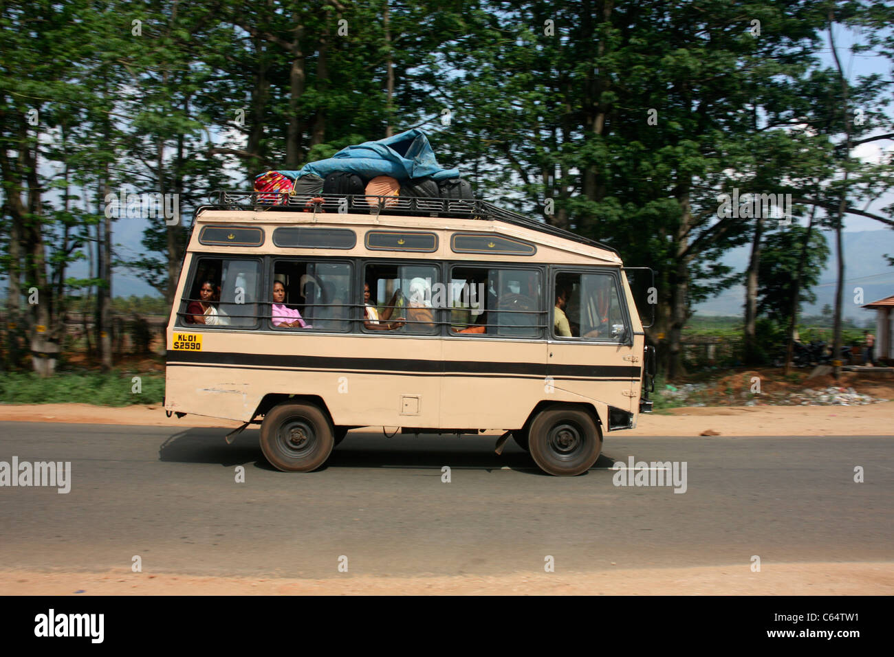 Mahindra mini bus speeds through the countryside of Tamil Nadu Southern