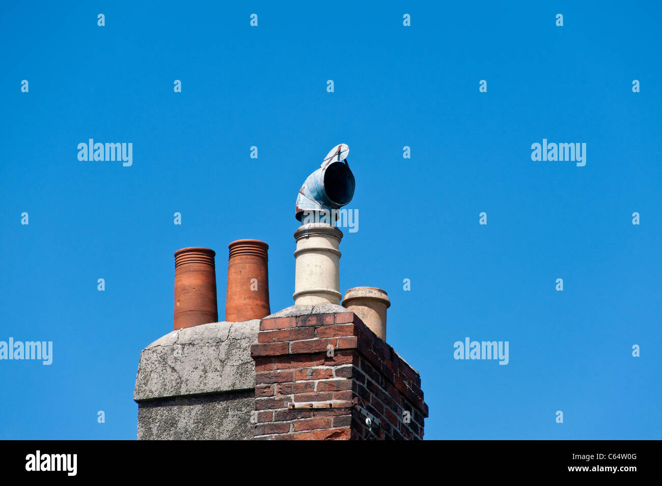 Chimney pots on older buildings in Honiton, Devon. One of the chimneys