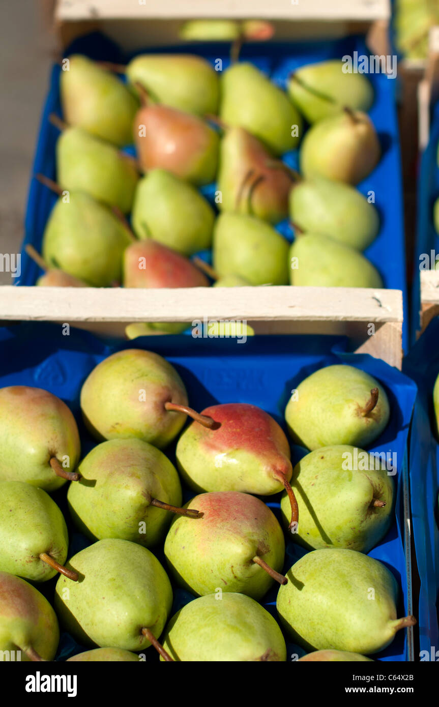 Pears in the crates in Wholesale market. Vertical image Stock Photo Alamy