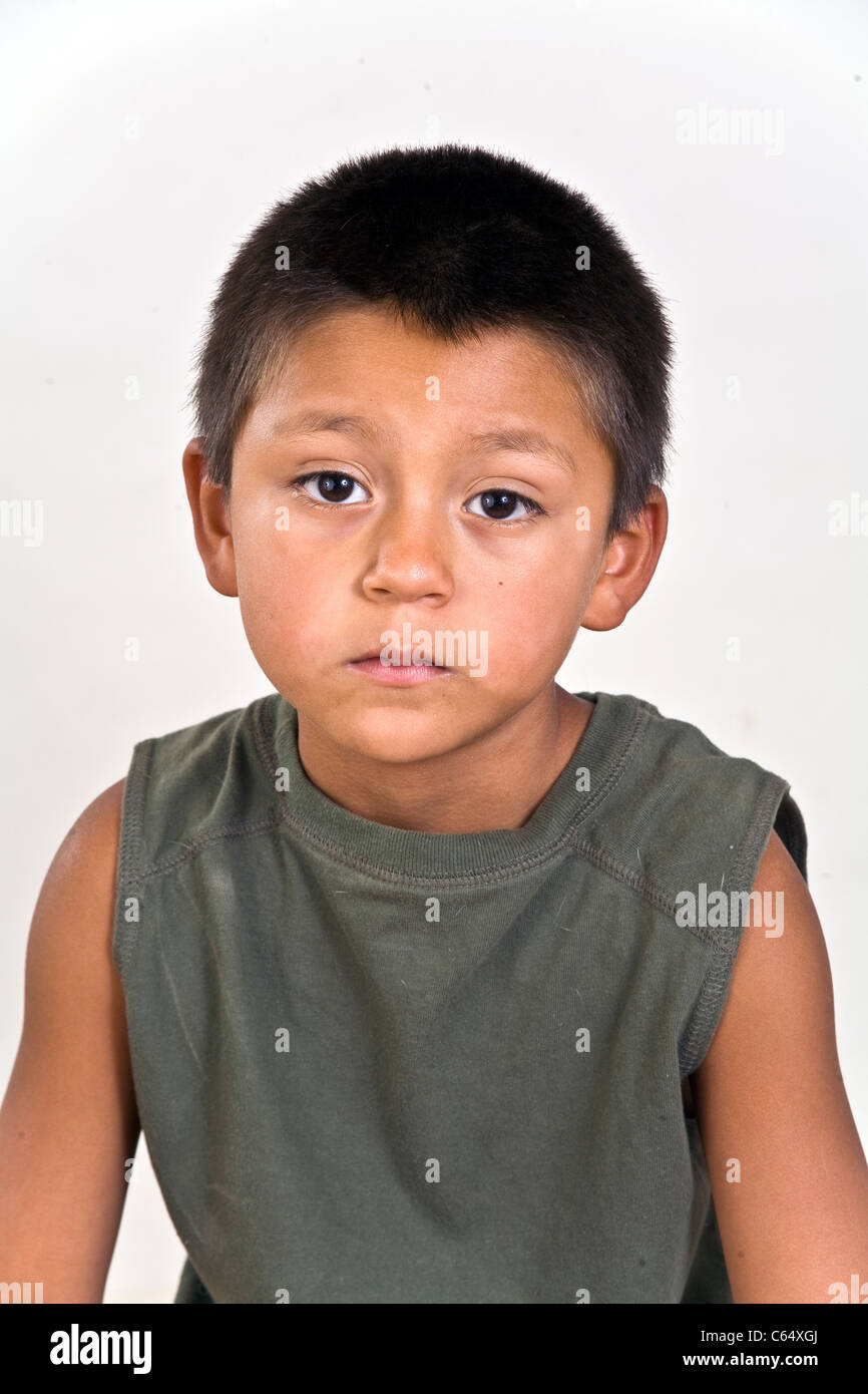 Sad hopeless 'poor me' expression 6-7 year old Hispanic boy . MR © Myrleen Pearson Stock Photo