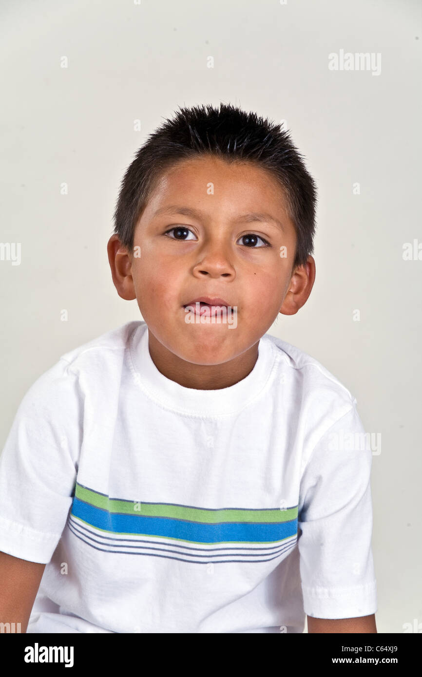 Thoughtful young 6-7 year old Hispanic boy child thoughtful dreaming sitting  MR © Myrleen Pearson Stock Photo