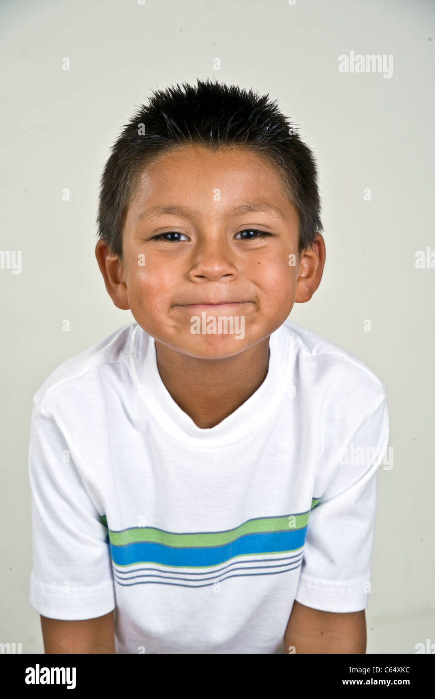 6-7 year old Hispanic boy making silly face mischievous . MR © Myrleen Pearson Stock Photo
