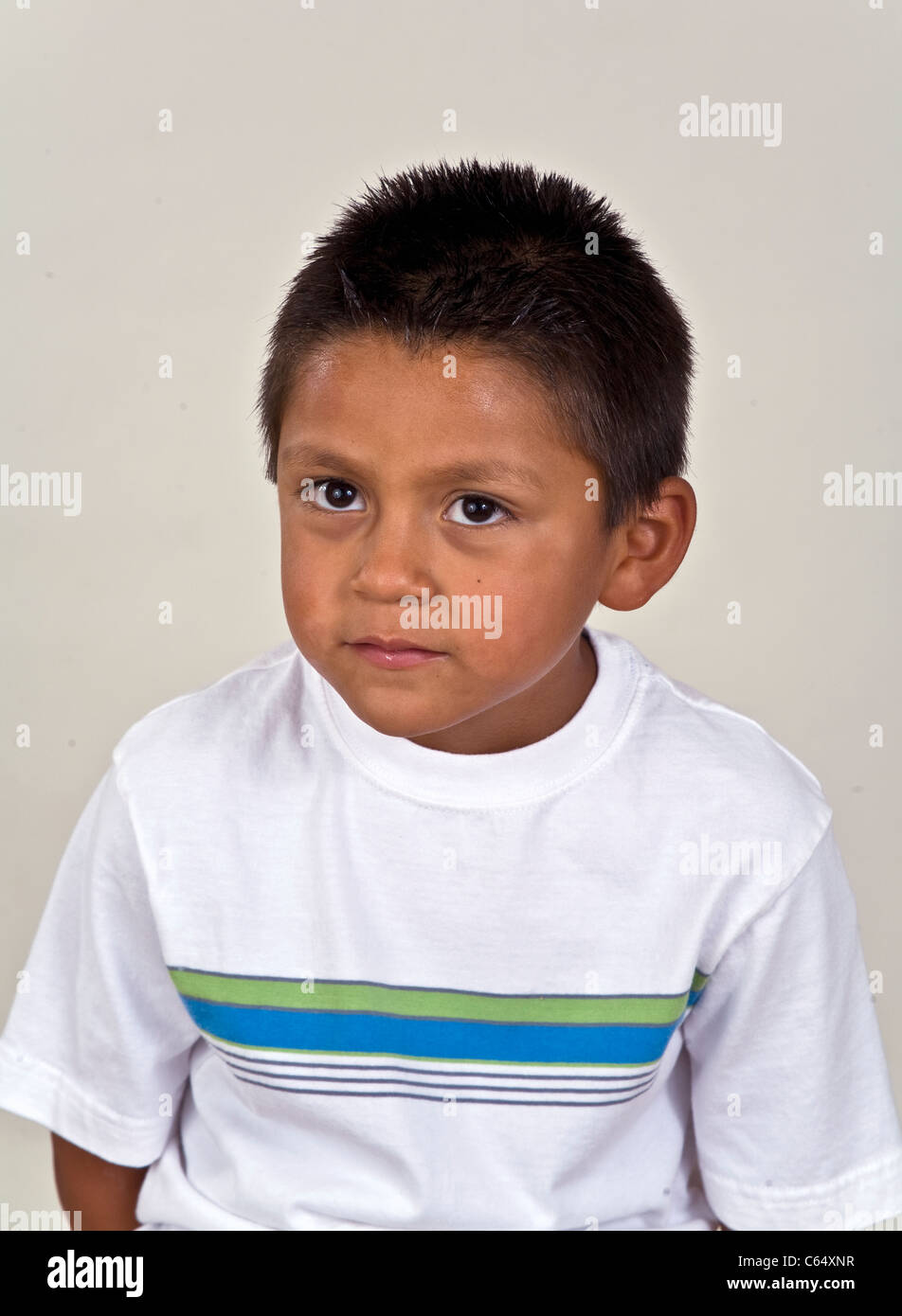 puzzled expression. Trouble? 6-7 year old Hispanic boy . MR © Myrleen Pearson Stock Photo