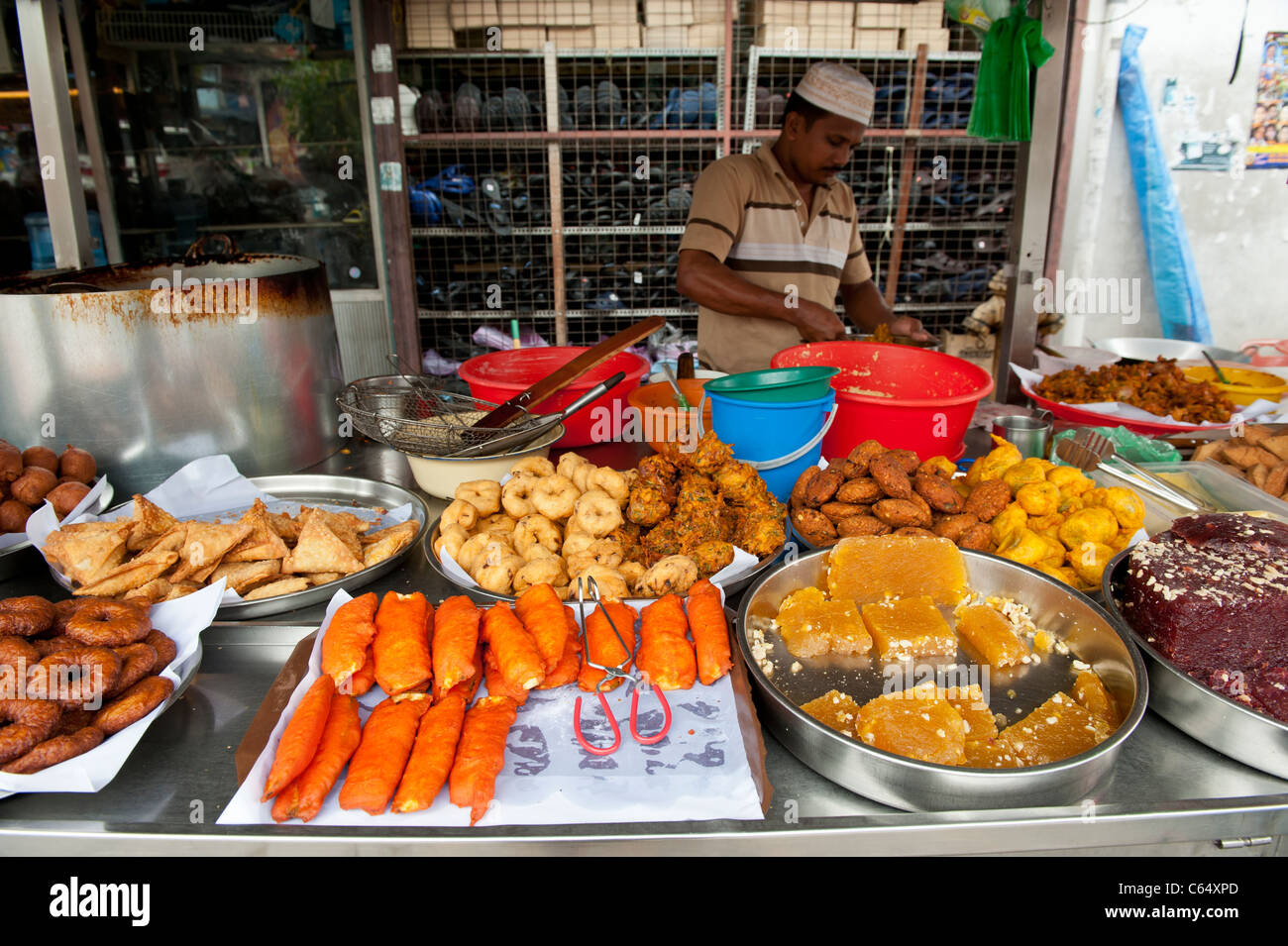 Indian Spiced Sweets, Desserts and Deep Fried Snacks on a Market Stall in Little India, Penang, George Town, Malaysia Stock Photo