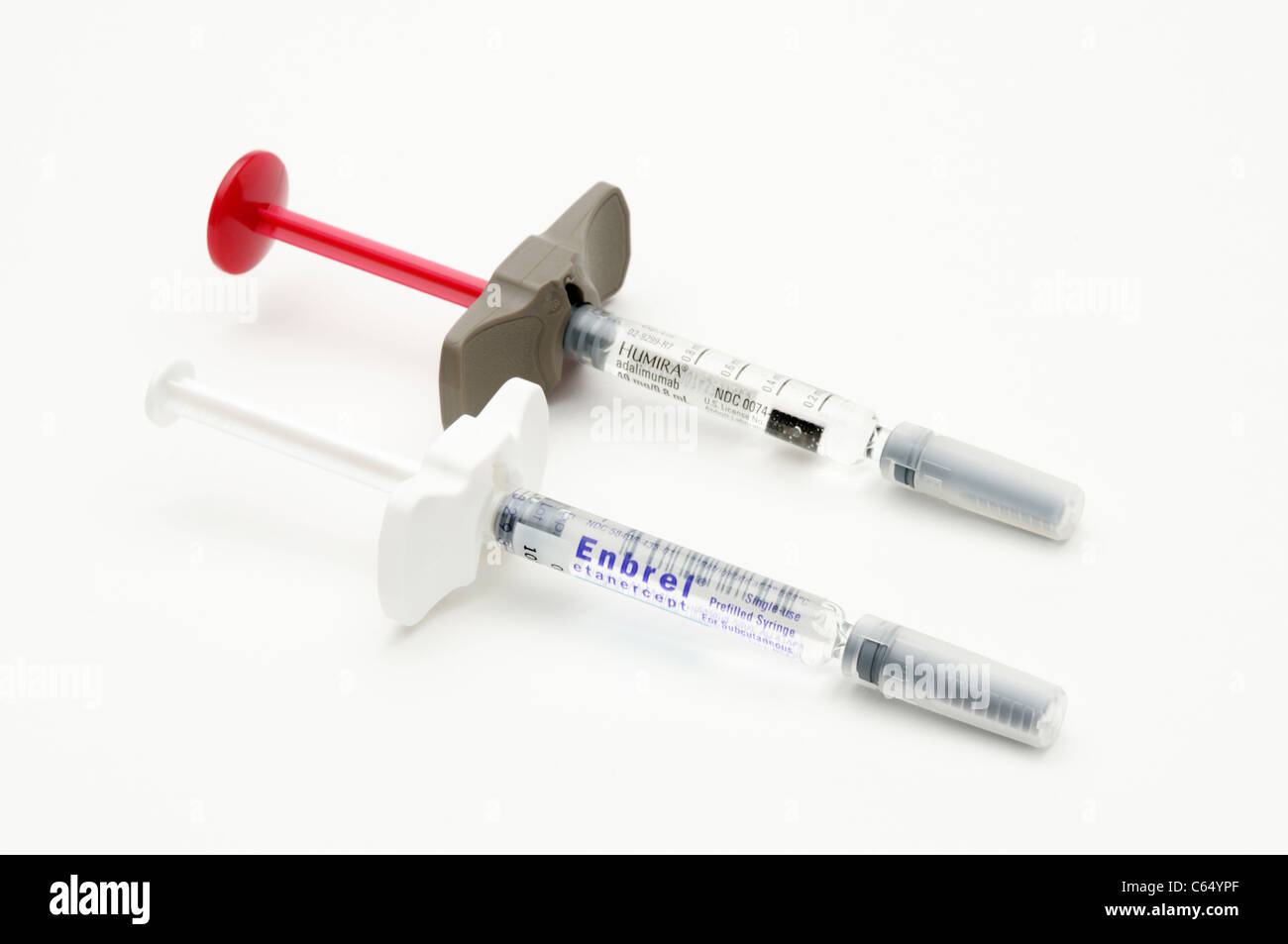 Pre-filled syringes of Etanercept (Enbrel) and Humira (Adalimumab), two treatments for inflammatory diseases like RA Stock Photo
