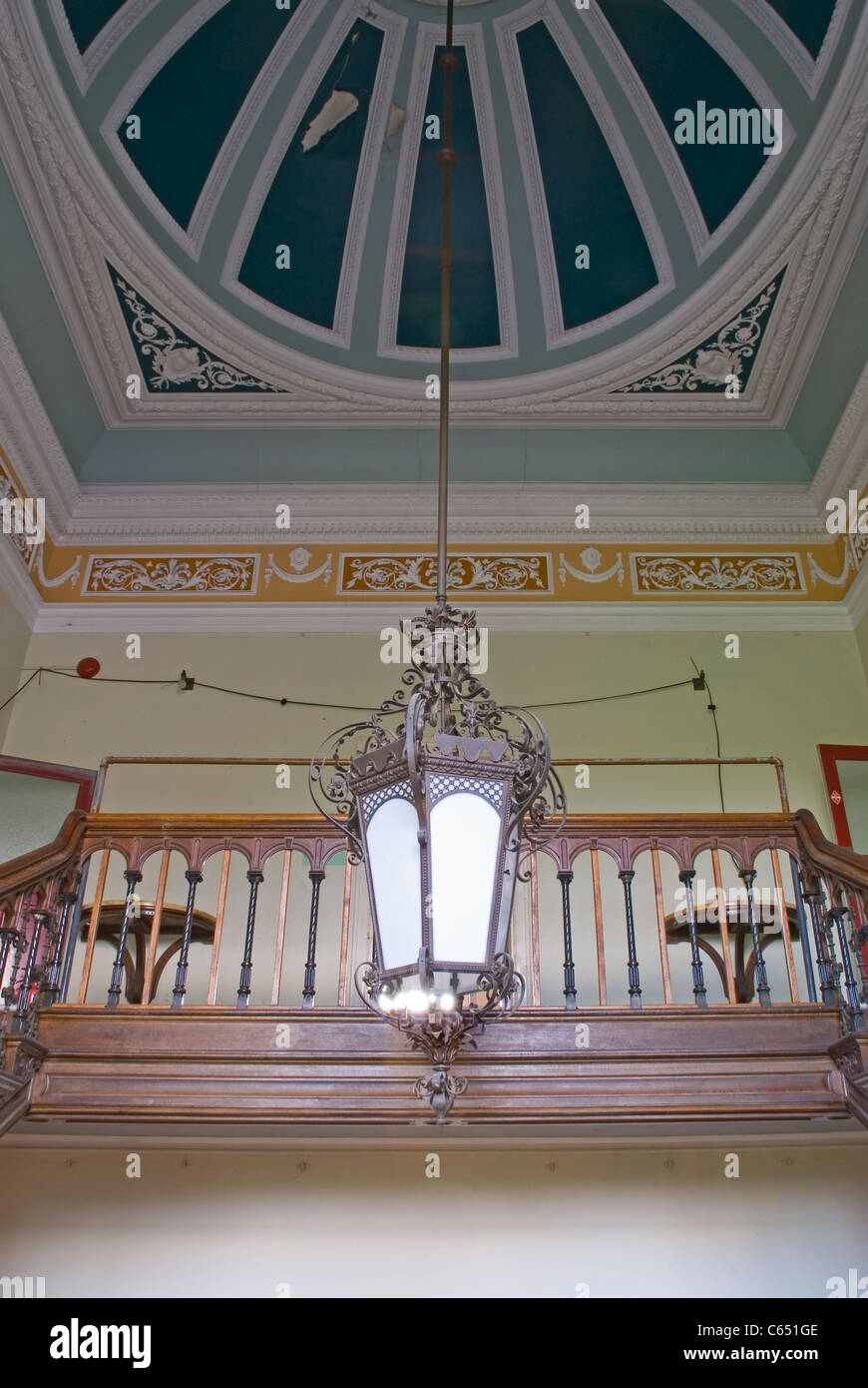 Interior of main staircase ceiling detail with original cornice and frieze and hanging lantern at Park Place, henley Stock Photo