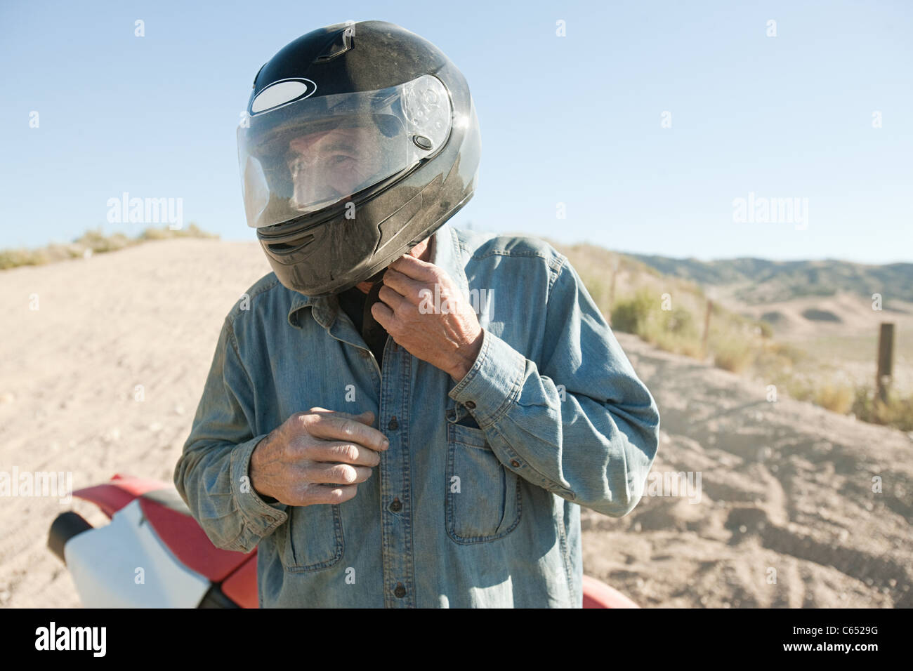 Man wearing crash helmet Stock Photo Alamy