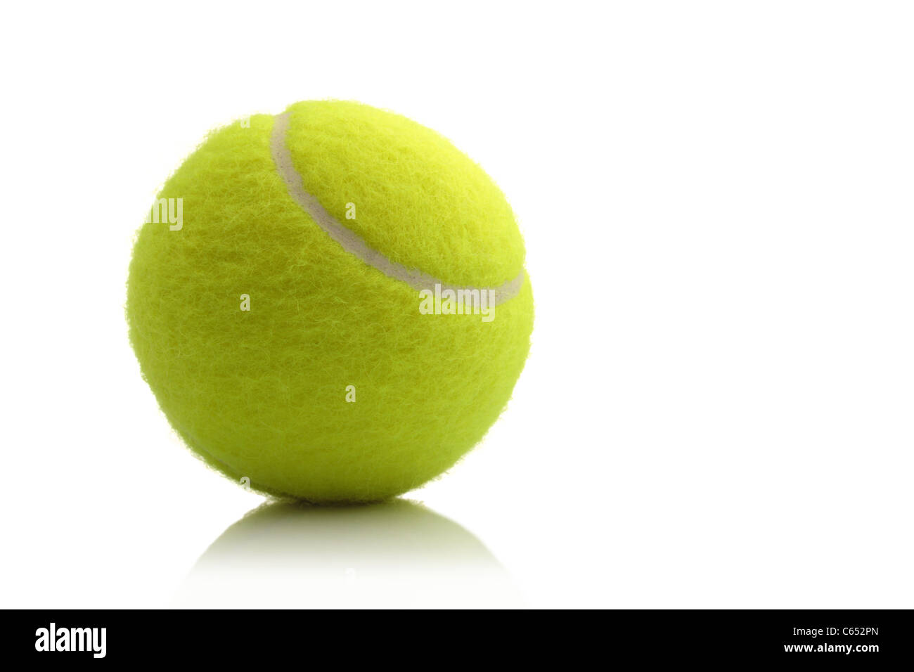 New unused tennis ball with a small reflection isolated against a white background Stock Photo