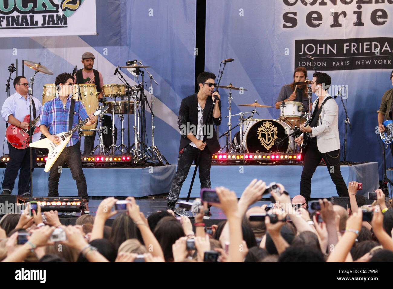 Nick Jonas, Joe Jonas, Kevin Jonas, (The Jonas Brothers) on stage for Good Morning America GMA Concert Series with The Jonas Brothers, Rumsey Playfield in Central Park, New York, NY August 13, 2010. Photo By: Rob Kim/Everett Collection Stock Photo