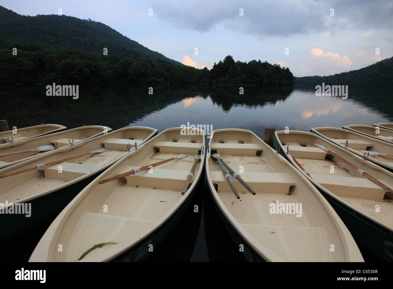 Boats Line Up in Lake Side Stock Photo