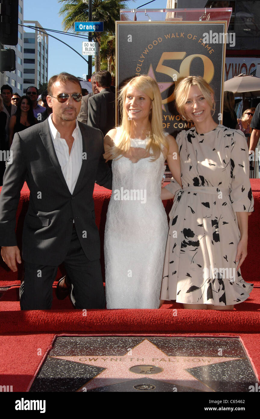 Tim McGraw, Gwyneth Paltrow, Shana Feste at the induction ceremony for Star on the Hollywood Walk of Fame Ceremony for Gwyneth Paltrow, Hollywood Boulevard, Los Angeles, CA December 13, 2010. Photo By: Michael Germana/Everett Collection Stock Photo