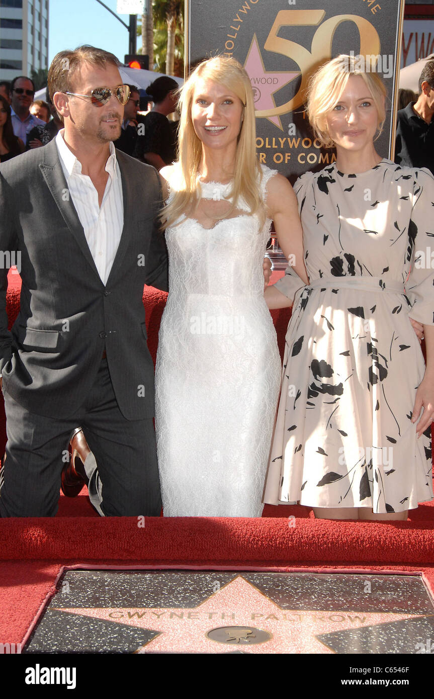 Tim McGraw, Gwyneth Paltrow, Shana Feste at the induction ceremony for Star on the Hollywood Walk of Fame Ceremony for Gwyneth Paltrow, Hollywood Boulevard, Los Angeles, CA December 13, 2010. Photo By: Michael Germana/Everett Collection Stock Photo