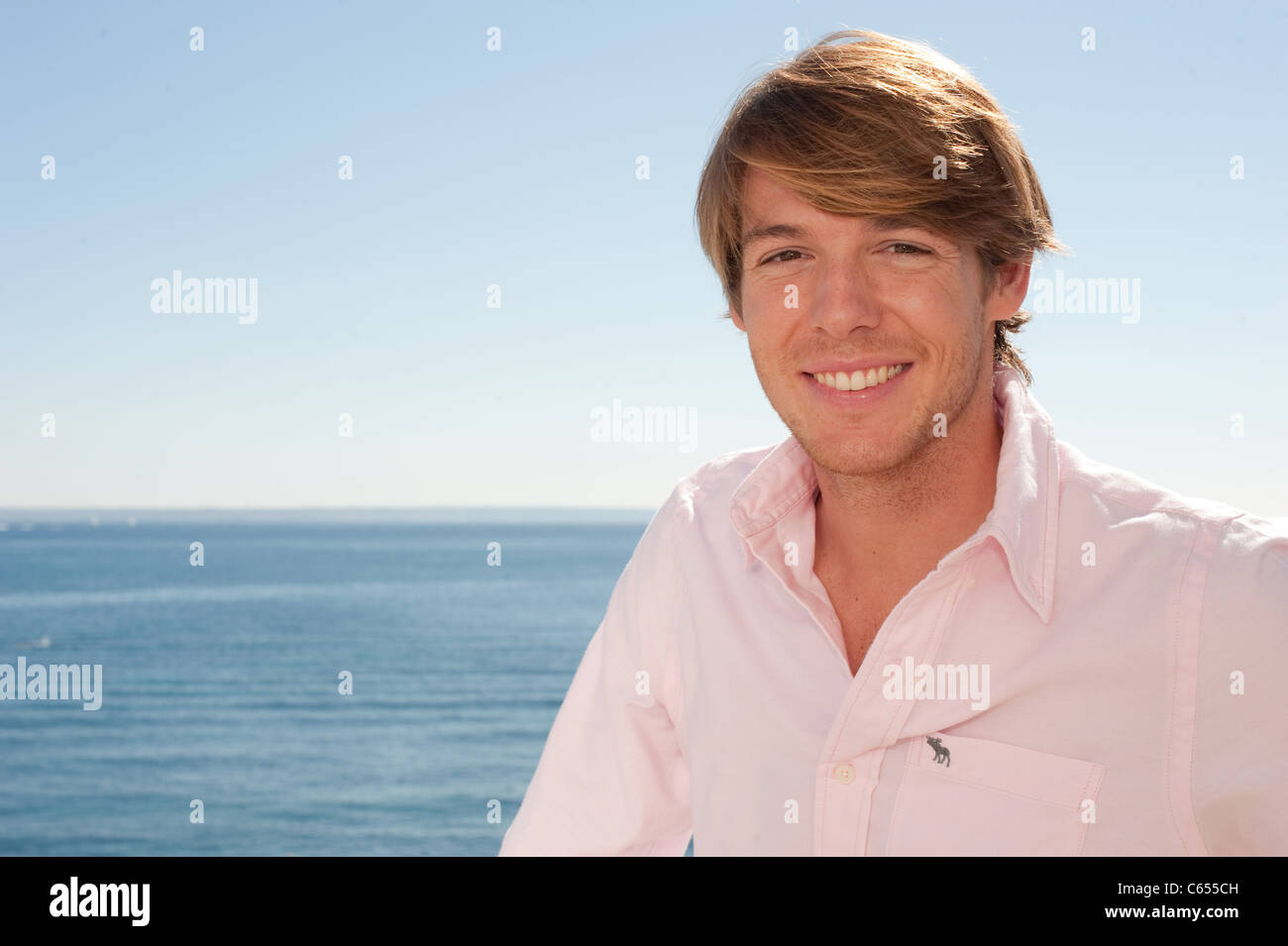 Man in pink shirt hi-res stock photography and images - Alamy