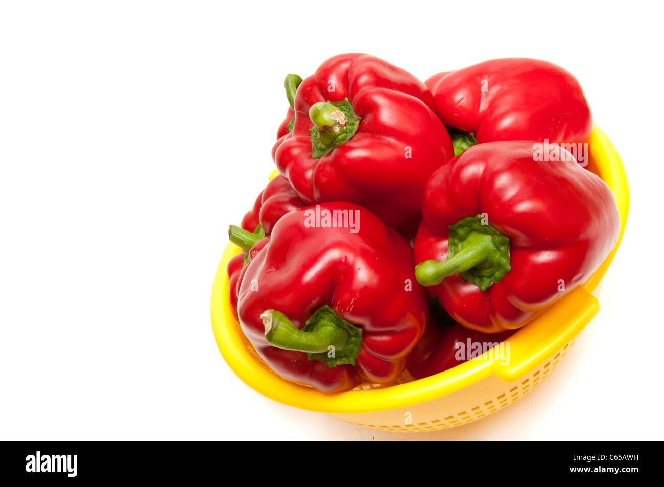 Red paprika in a bowl on white background Stock Photo