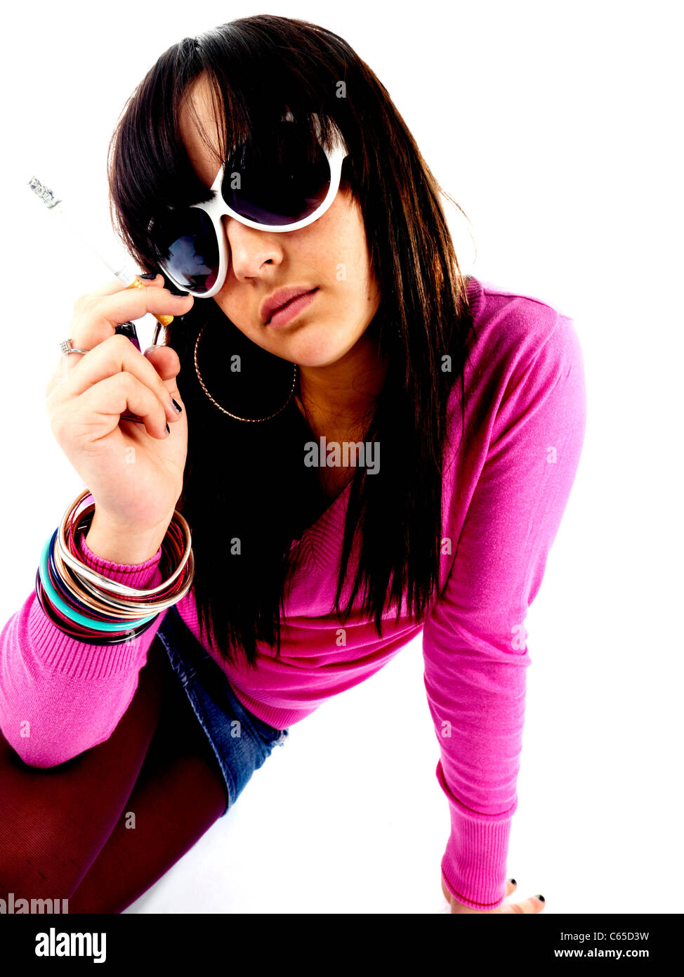Girl holding smoking cigarette cigarrette hires stock photography and