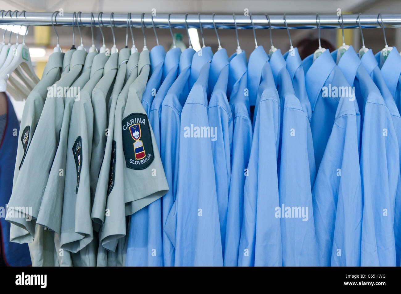 a-pile-of-blue-and-green-shirts-in-factory-stock-photo-alamy