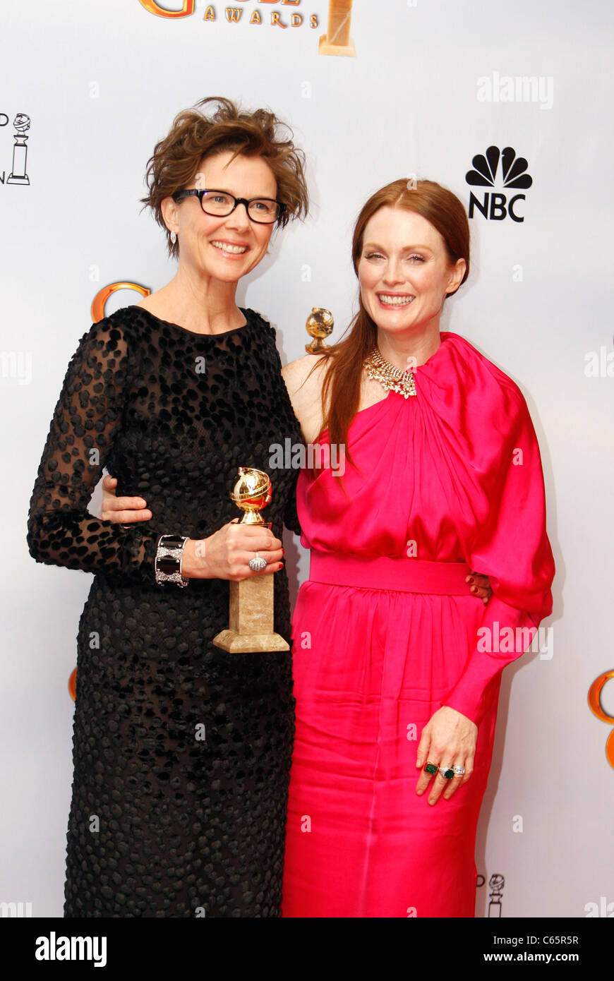 Annette Bening (wearing Tom Ford), Julianne Moore (wearing Lanvin) in the press room for The Hollywood Foreign Press Association 68th Annual Golden Globes Awards - PRESS ROOM, Beverly Hilton Hotel, Los Angeles, CA January 16, 2011. Photo By: Jef Hernandez/Everett Collection Stock Photo