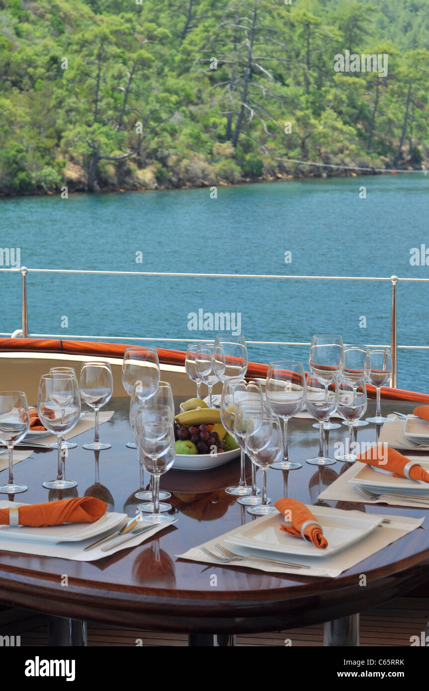 dinner table the deck of luxury sailboat Stock Photo