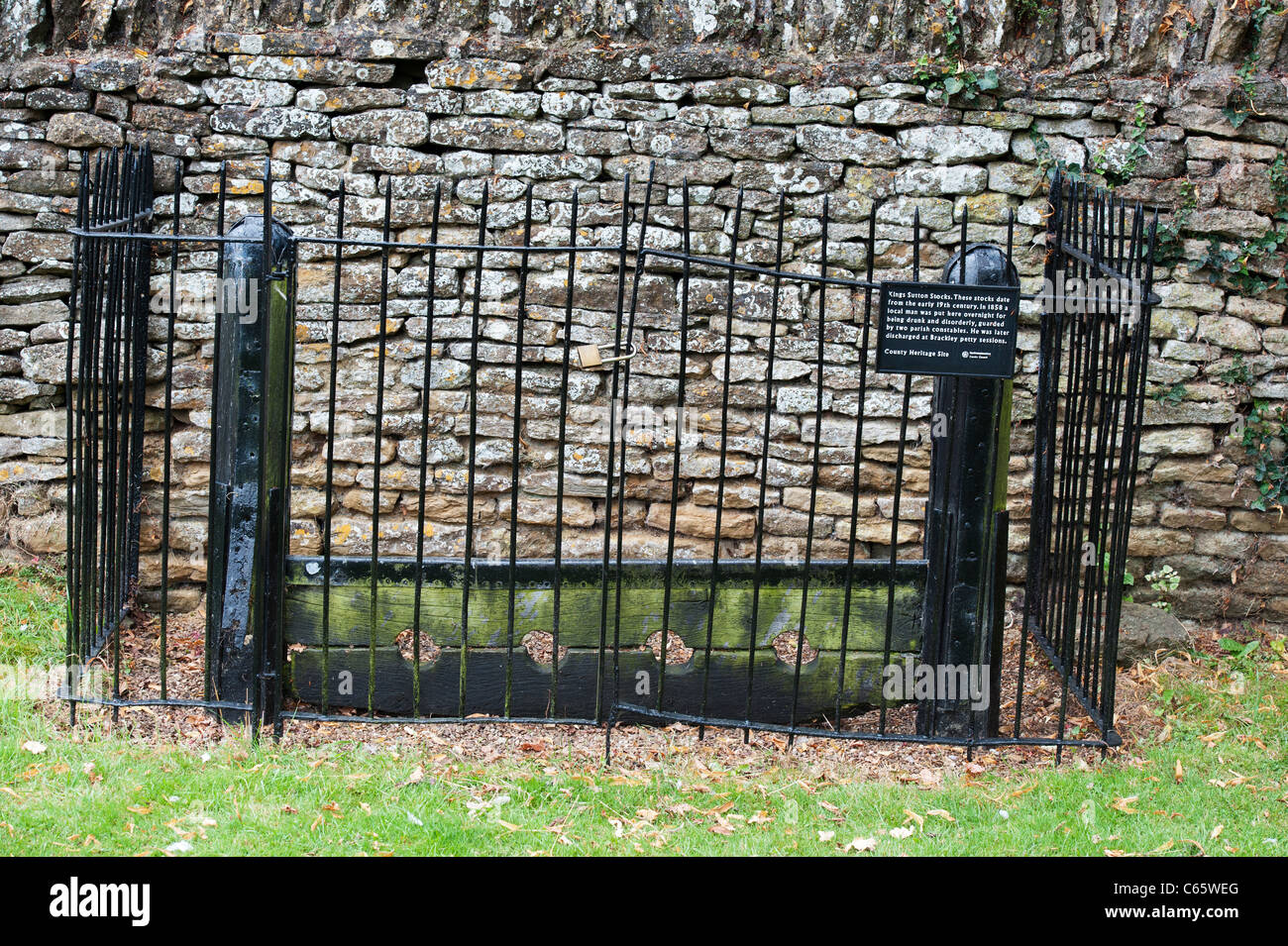 Old Village stocks . Kings Sutton, Nr Banbury, Northamptonshire, England Stock Photo