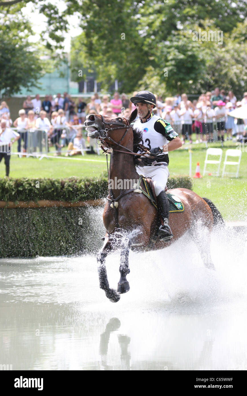 Ruy Fonseca of Brazil at the water jump during the cross country part of the equestrian event in Greenwich Park. Stock Photo