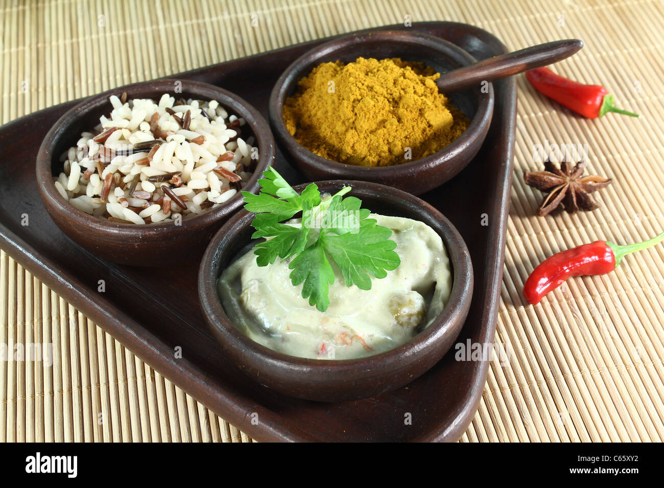 Indian green Curry with wild rice, chilli and bamboo shoots Stock Photo
