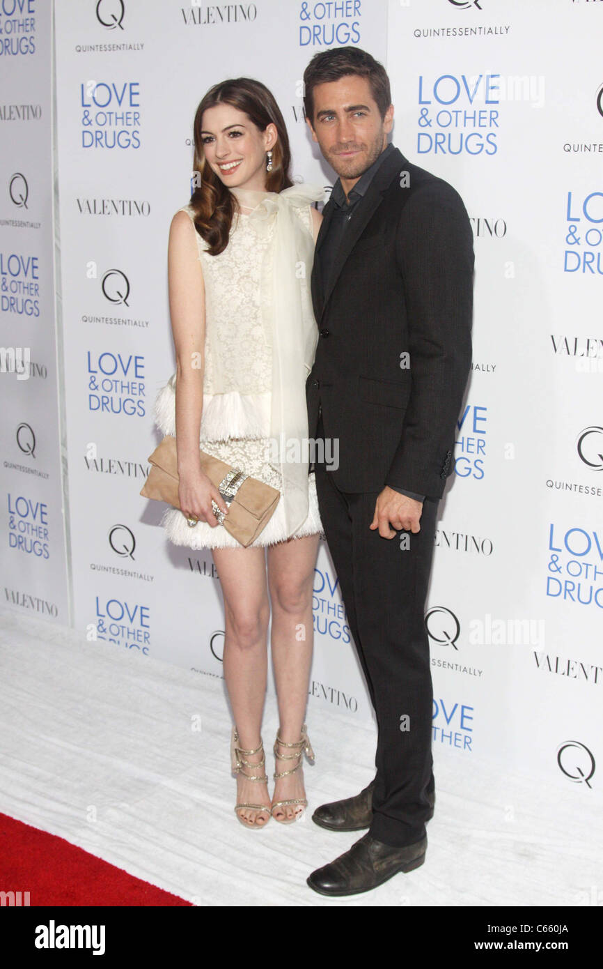 Anne Hathaway (wearing a Valentino Couture dress), Jake Gyllenhaal at arrivals for LOVE AND OTHER DRUGS Premiere, Directors Guild of America (DGA) Theater, New York, NY November 16, 2010. Photo By: Rob Kim/Everett Collection Stock Photo
