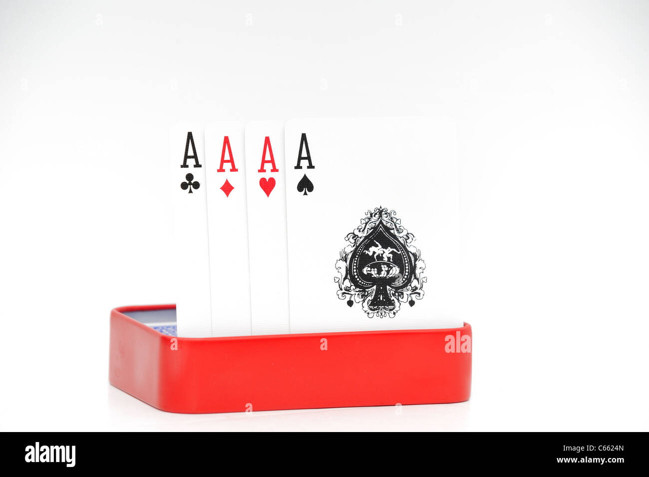 4 four aces in a red tin on a white background Stock Photo