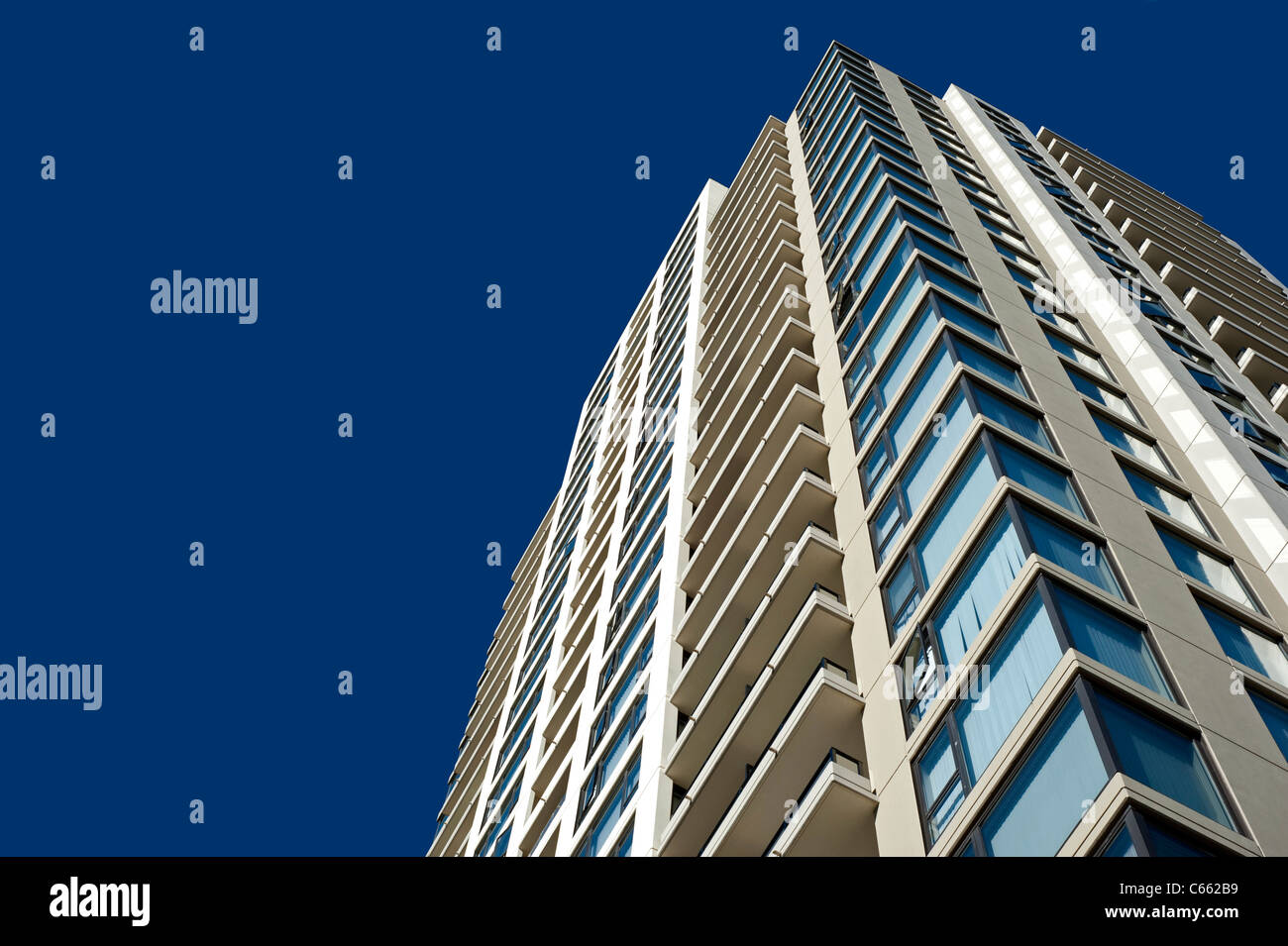 Modern new residential building with balconies and glass windows Stock ...