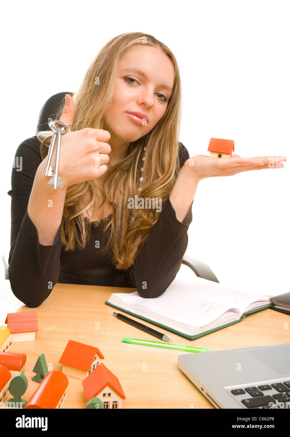 Businesswoman with keys and house on her palm Stock Photo - Alamy