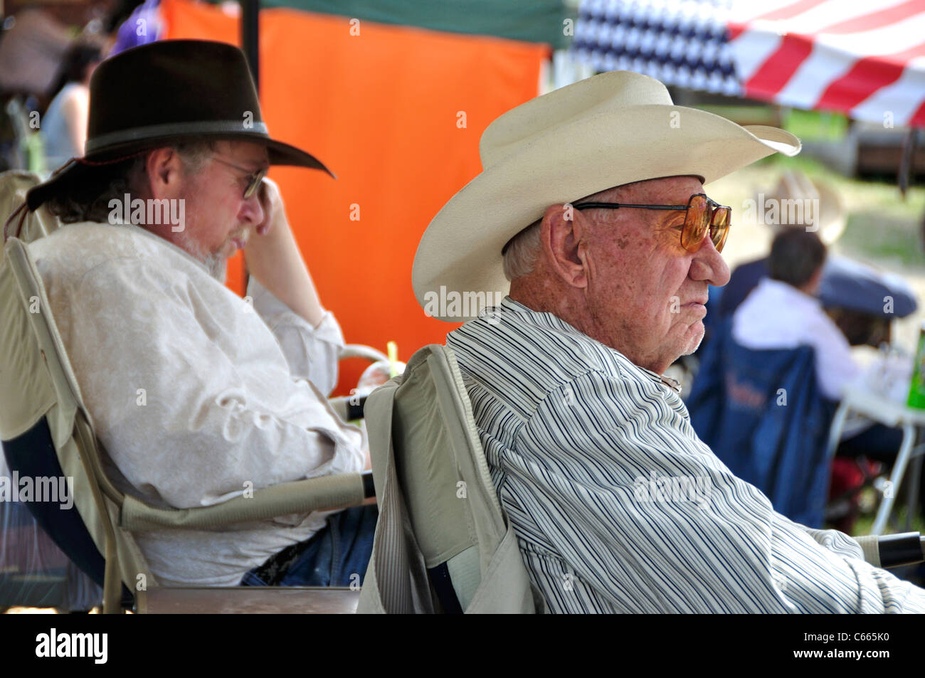 Contestants at a fast draw competition during 'Pioneer Days' taking a break Stock Photo
