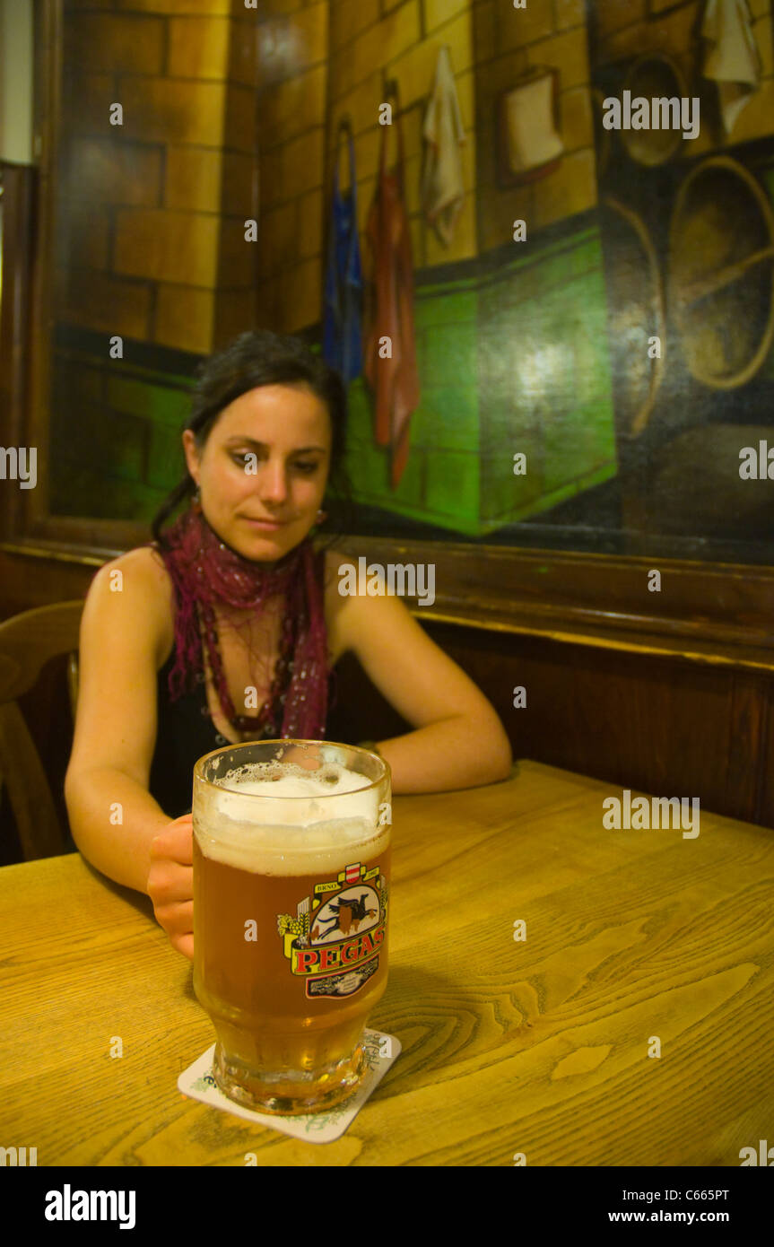Woman in her early 30s with a big beer mug in microbrewery beer hall in Hotel Pegas Brno city Moravia Czech Republic Europe Stock Photo