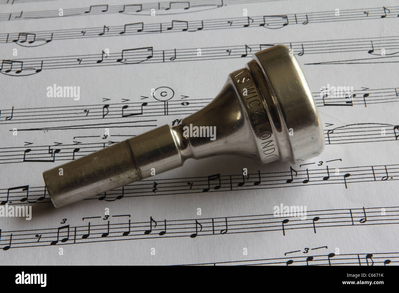 tenor horn mouthpiece on sheet of music Stock Photo Alamy