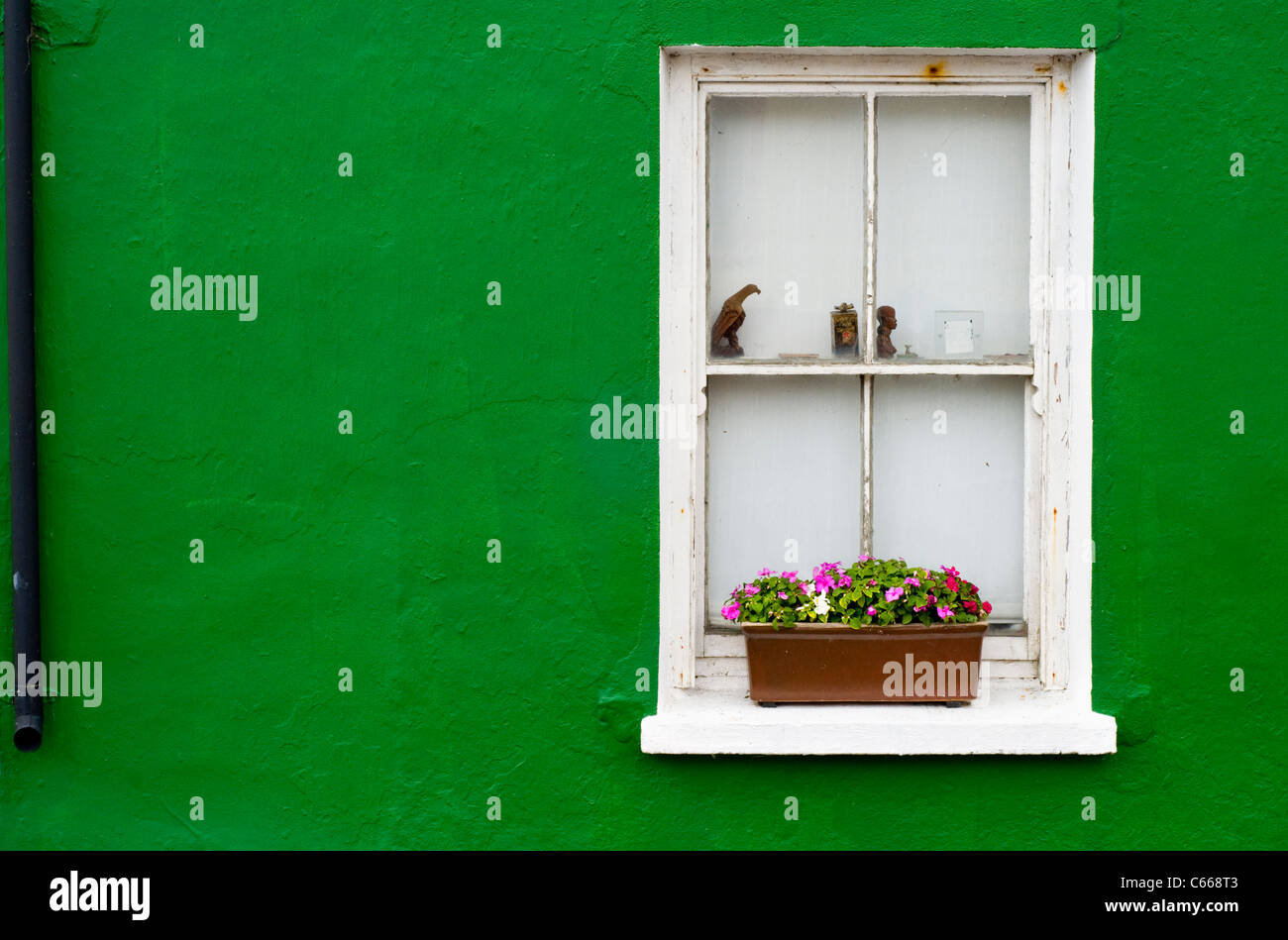 The front of a green house in the village of Allihies, County Cork, Ireland Stock Photo