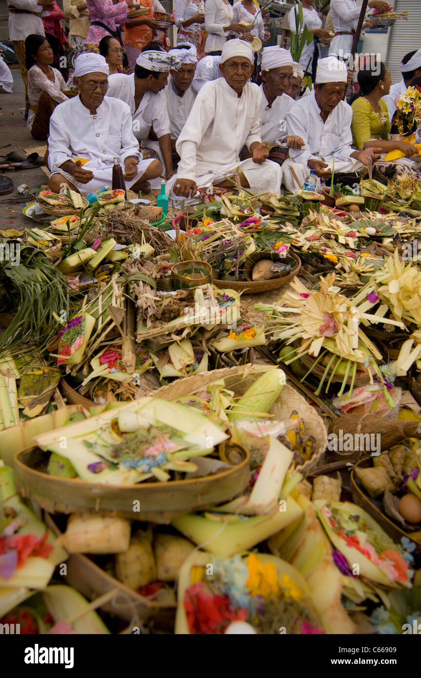 Piles of religious offerings know as Canang sari at a Balinese Hindu street festival. Bali Stock Photo