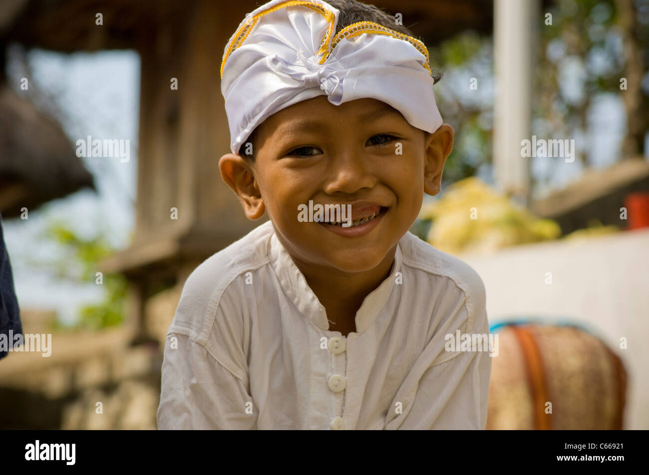 Smiling Balinese boy in traditional costume Stock Photo - Alamy