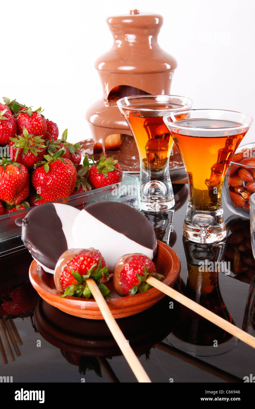 Almond liquor and strawberry chocolate fondue Stock Photo Alamy